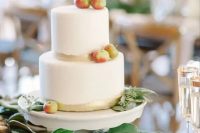 a simple modern fall wedding cake with gold touches and fresh apples and euclayptus is a very cool and beautiful idea