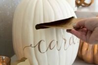 a white pumpkin with calligraphy styled as a wedding card box is ideal for a rustic fall wedding, and such a DIY doesn’t require much time