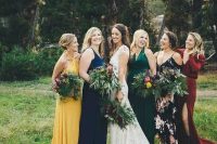 amazing mismatching bridesmaid dresses – a yellow, navy, emerald, burgundy and black floral one for a bright fall wedding