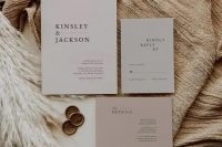 an elegant neutral-colored minimalist wedding invitation suite in light grey and dusty pink, with black lettering is a cool idea