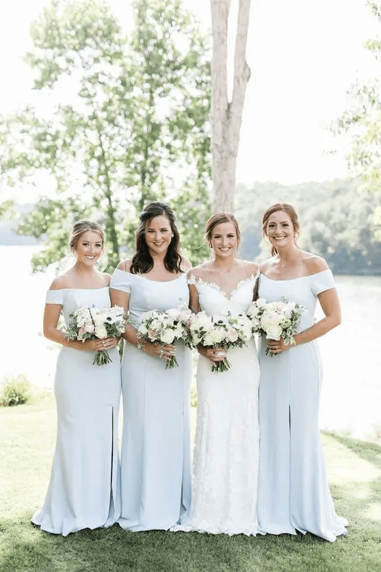 beautiful white off the shoulder maxi bridesmaid dresses with slits and small trains for a refined summer wedding