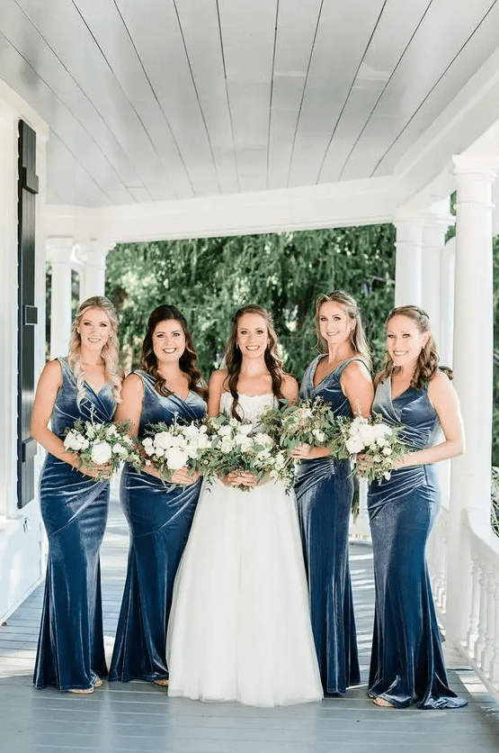 blue velvet mermaid bridesmaid dresses with draped bodices, V-necklines are a cool solution for a coastal wedding