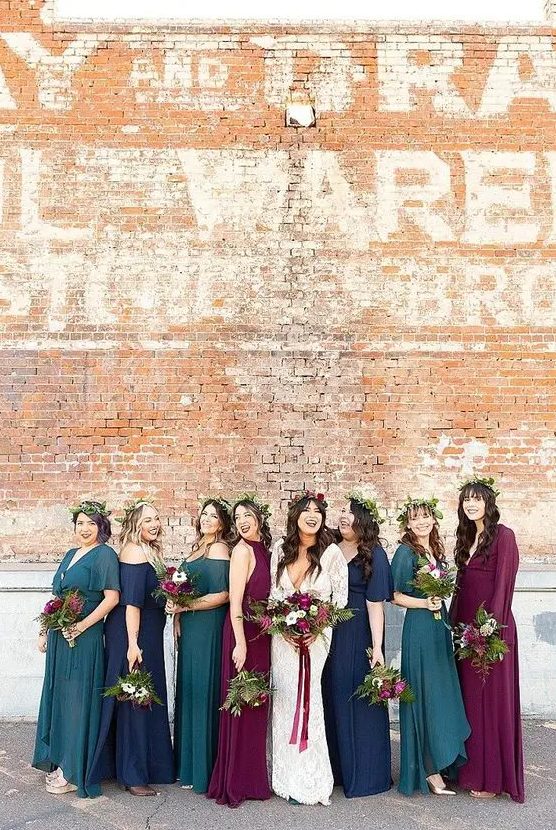 bright teal, navy, purple bridesmaid dresses with mismatching designs are perfect for a bold and jewel-toned fall wedding