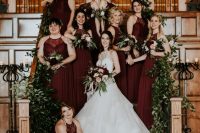 classic burgundy halter neck maxi bridesmaid dresses with lace bodices and pleated skirts for a refined fall wedding