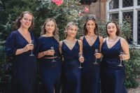 cool midi and maxy navy bridesmaid dresses paired with black shoes are a super chic idea for fall or winter