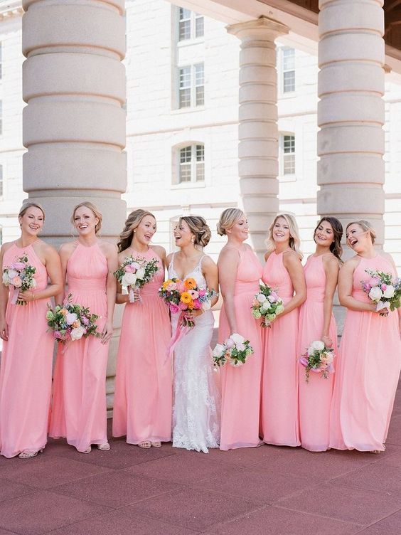 eye-catchy pink halter neck maxi bridesmaid dresses are a cool idea for a bright wedding with a pink color palette