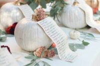 large pumpkins holding lists create a lovely and unique wedding seating chart that is totally fall-style, try this out