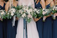 lovely matching navy maxi bridesmaid dresses with straps and draped bodices will do for any wedding