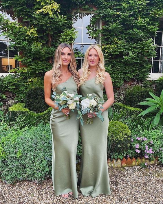 matching one shoulder satin mermaid green bridesmaid dresses are a lovely idea for a spring or summer wedding