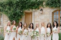 minimalist white halter neckline maxi bridesmaid dresses with front slits are a cool and breezy idea for spring or summer weddings