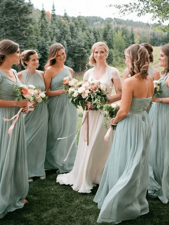 Mint colored maxi bridesmaids' dresses including one shoulder and halter ones are perfect for a pastel colored spring or summer wedding