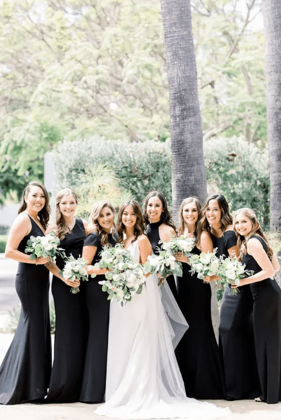 mismatching black mermaid bridesmaid dresses of plain fabric are adorable for a chic and glam wedding