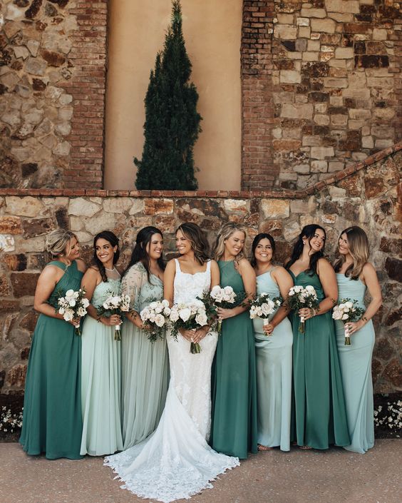 mismatching green and mint green maxi bridesmaid dresses with halter and other necklines are cool for spring and summer