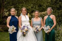 mismatching navy and green halter neck bridesmaid dresses and a grey dress with straps are cool for a fall wedding