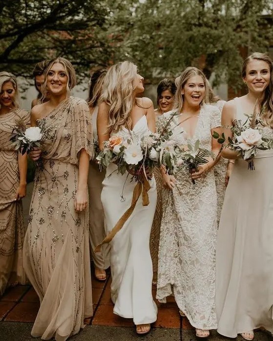 mismatching nude and white bridesmaid maxi dresses are adorable for an early fall wedding with a neutral color scheme
