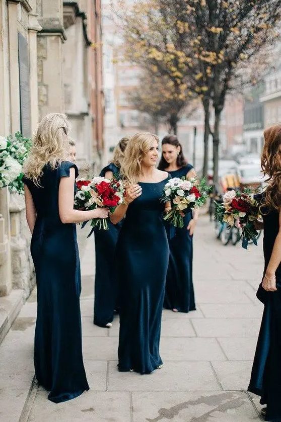 navy maxi dress with a bateau neckline look super chic and contrast the blooms, ideal for a formal wedding