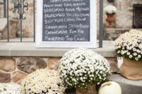 pretty fall wedding decor with potted blooms and white pumpkins is amazing for embracing the fall