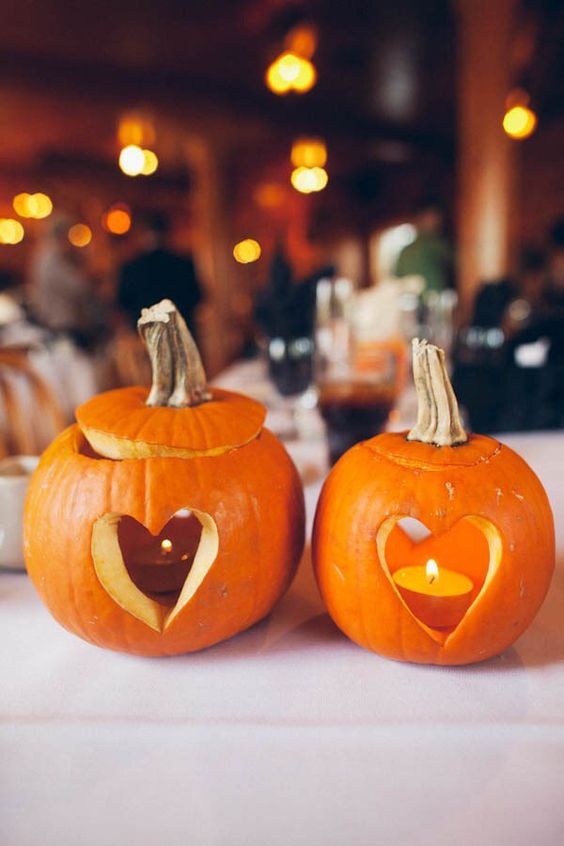 pumpkins with cutout hearts and candles inside will be a great decoration for tables, sweets tables and just for the venue