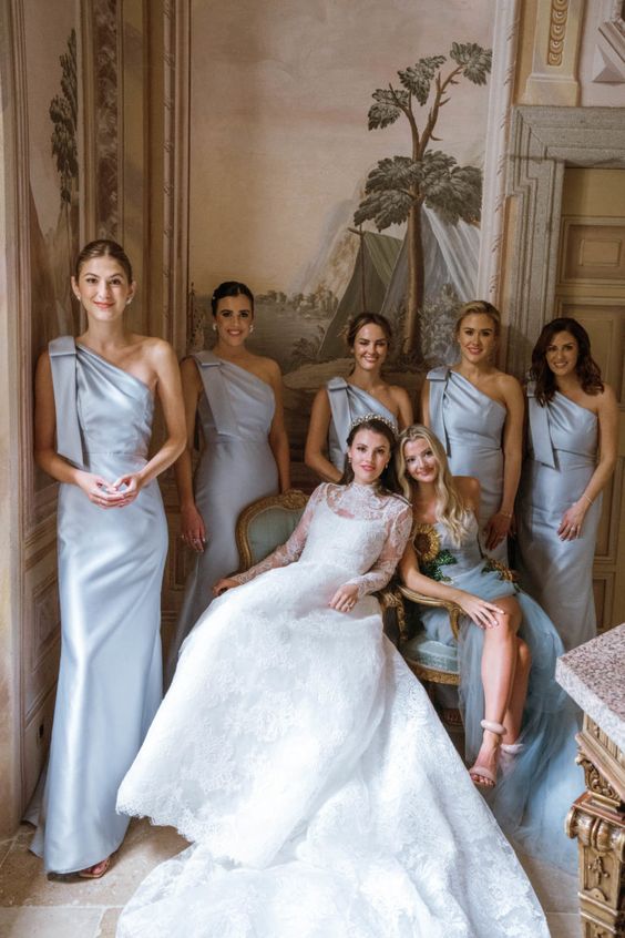 refined grey one shoulder maid bridesmaid dresses with large bows on the shoulder are a cool idea for a refined modern wedding