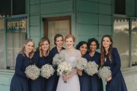 refined navy maxi bridesmaid dresses with long sleeves and baby’s breath bouquets for a contrast are wow