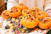 serve food in real pumpkins to make your wedding fall more like fall