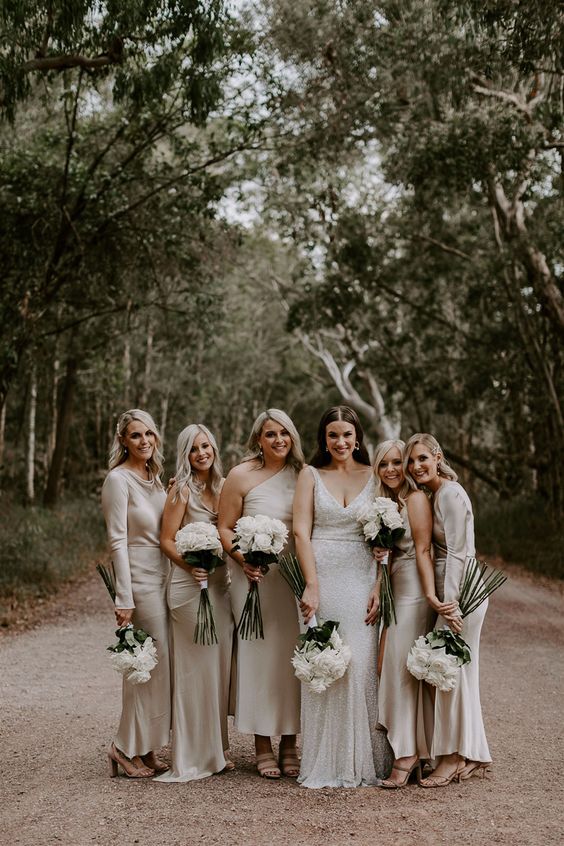 silver maxi and midi bridesmaid dresses with mismatching necklines including one shoulder for a modern wedding