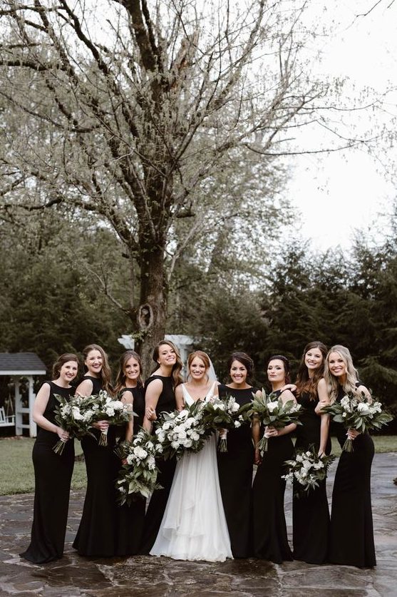 sleeveless black maxi bridesmaid dresses with high necklines are a chic and timeless idea for a wedding