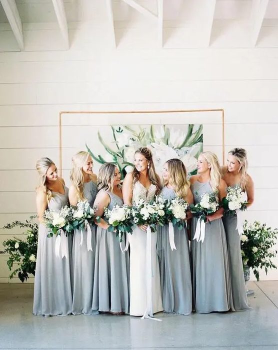 sleeveless light grey maxi bridesmaid dresses with draped and embellished bodices for a spring wedding
