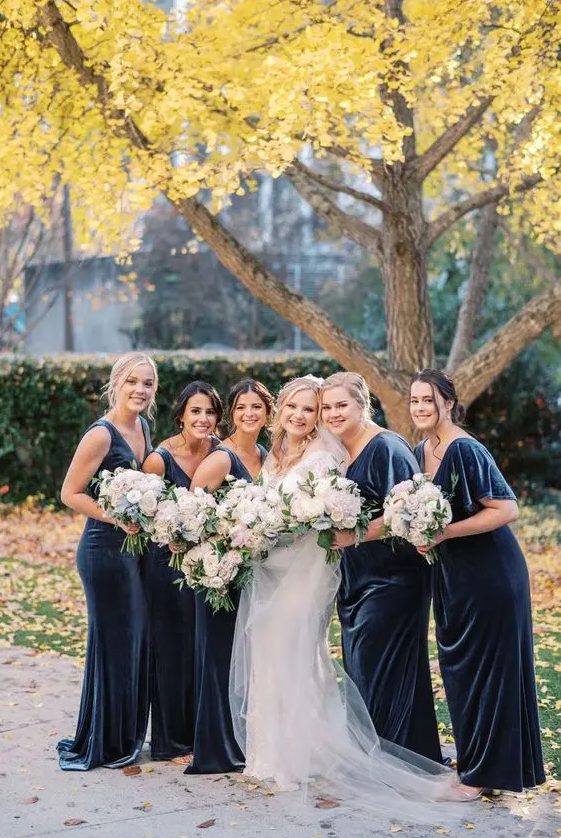 sophisitcated navy maxi bridesmaid dresses with and without sleeves look fantastic and are ideal for a fall or winter wedding