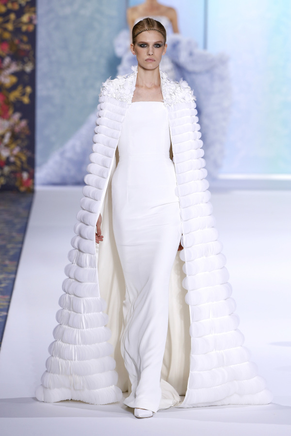 Ralph&Russo features a minimalist strapless dress with a fur coat