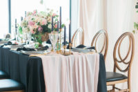 03 The black tablecloth is softened by a blush chiffon table runner