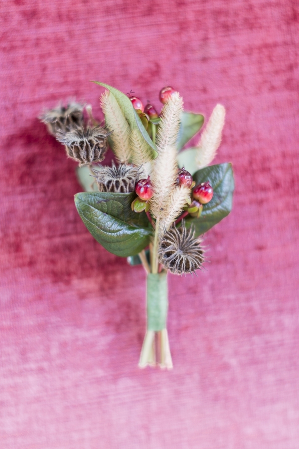 The boutonniere is textural and fall-inspired