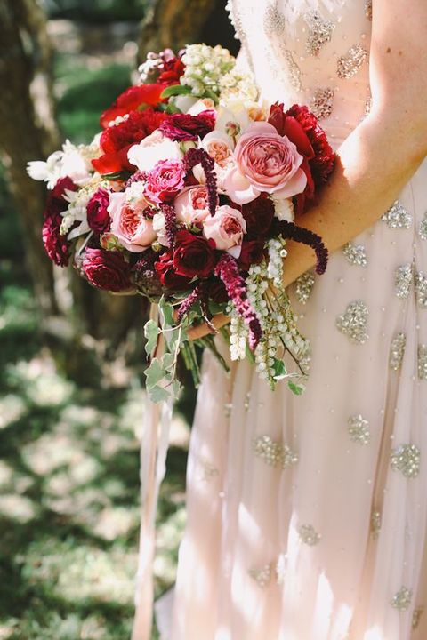 lush fall bouquet in crimson, burgundy and blush and a blush glitter dress