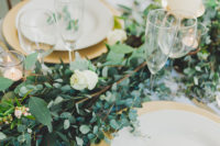06 The tablescape was simple and natural with a greenery and white rose table runner