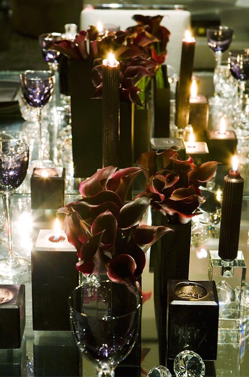 black candles and dark purple callas for table decor