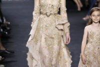 07 Elie Saab showed a sparkling gold wedding dress with an illusion necklines and a gold sash