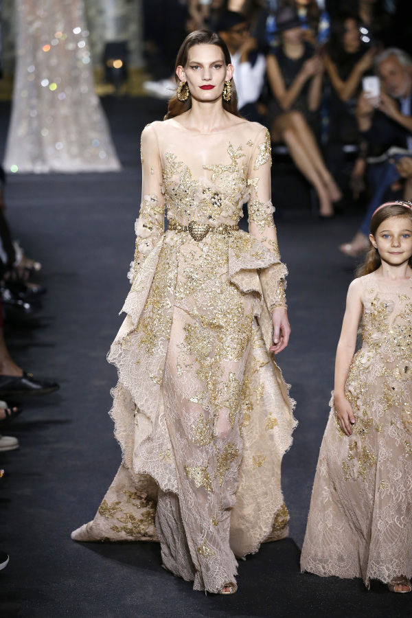Elie Saab showed a sparkling gold wedding dress with an illusion necklines and a gold sash