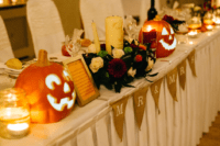 08 Jack-o-lanterns, burlap, candles and bold fall flowers created an ambience