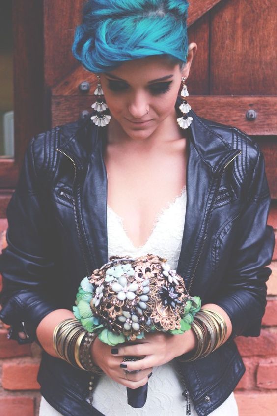 rock bride in a sweet white dress and a cropped leather jacket