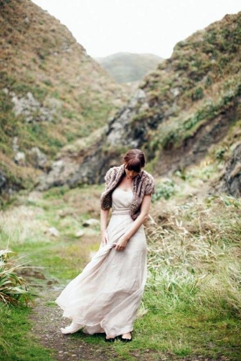 brown faux fur vest and a nude wedding dress