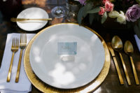 10 The table setting features gold tableware, chargers, various flowers and crystals