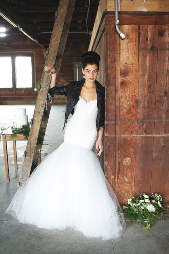 rock n roll bride in a mermaid gown and a leather jacket