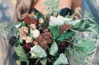 11 moody bridal bouquet with large green leaves