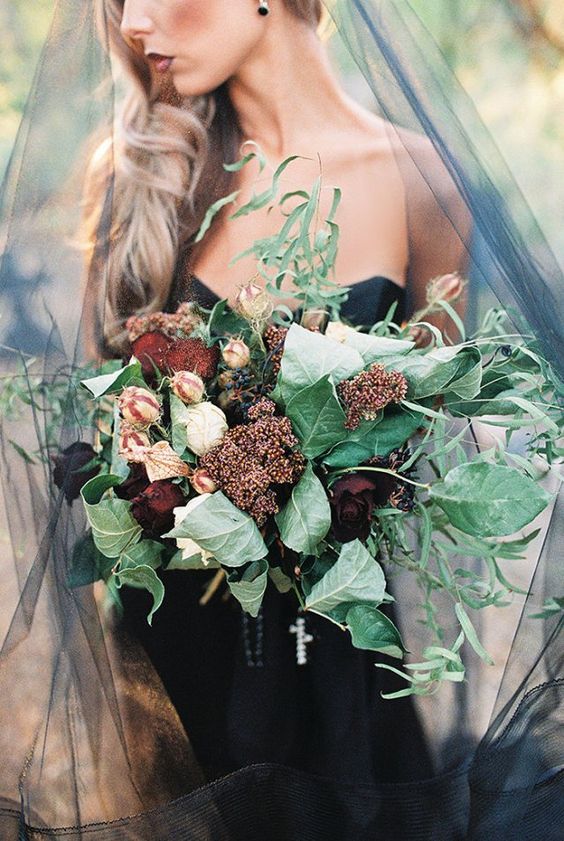 moody bridal bouquet with large green leaves