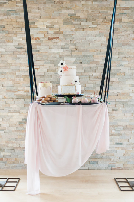 The dessert table was hung, it was also done in blush and black