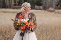 14 fur shawl is a fashionable touch to the bride’s ensemble