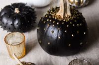 17 black pumpkins with black and gold metallic studs
