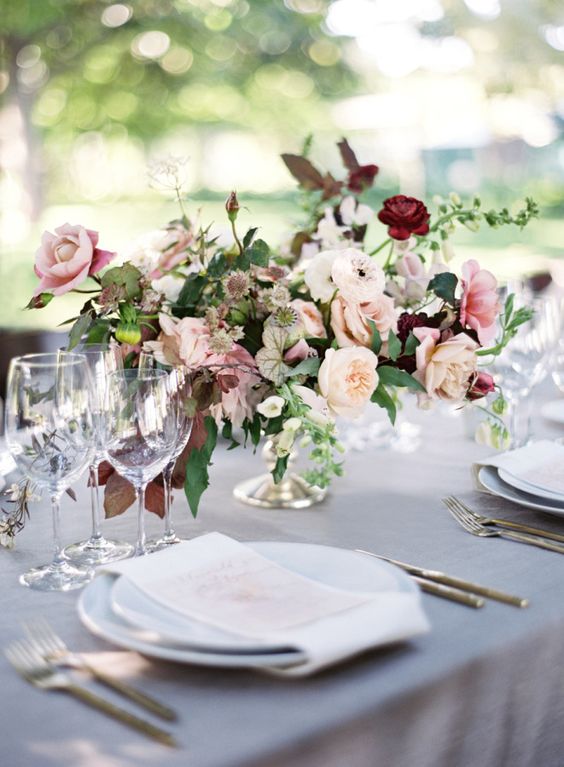 blush and white centerpiece with burgundy additions