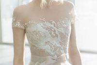 22 nude short sleeve wedding dress with an illusion neckline