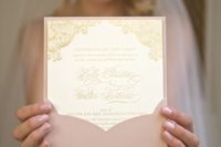 23 blush envelopes and gold invitations